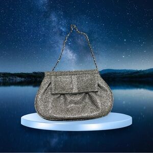 Elegant Silver Evening Clutch with Chain Strap and a Bow Accent on the Front